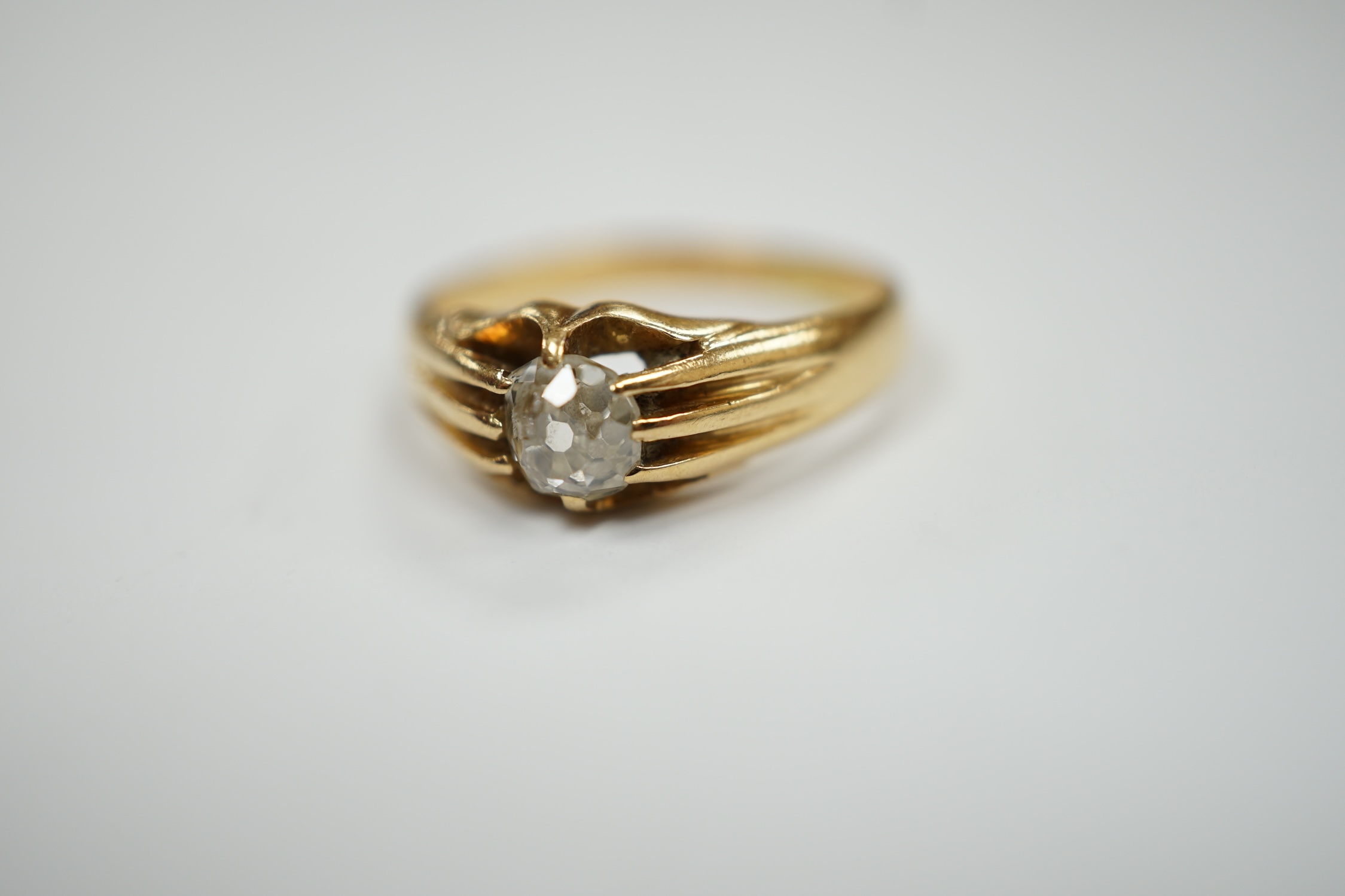 An 18ct gold and claw set solitaire diamond ring, size L, gross weight 3.5 grams.